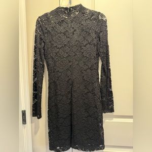 BCBGeneration lace dress. 100% polyester. Black slip underneath.